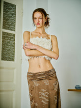 Load image into Gallery viewer, WAYT Pirouette kahverengi saten midi etek, el yazılı desenli kumaş, kampanya çekiminde önden editorial görünüm
