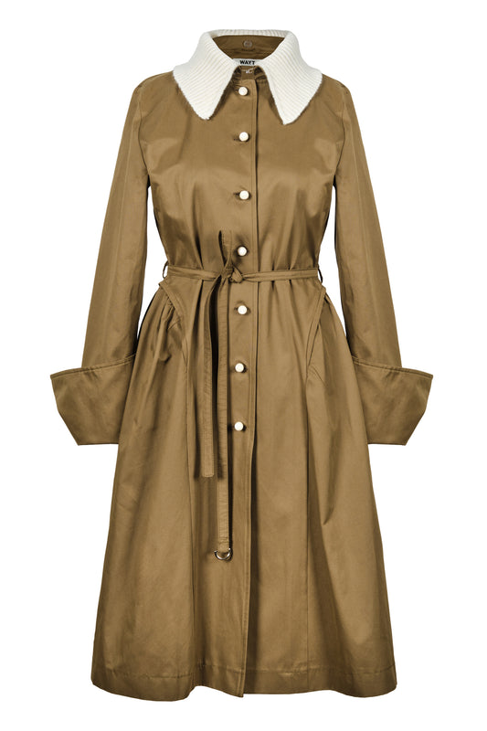 Front view of WAYT Studio Grotesk Dreams Khaki Trench Coat featuring a detachable cream knit collar, water-repellent gabardine fabric, and enamel buttons.